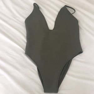 Sexy, low cut one-piece Wanderlust swimsuit
